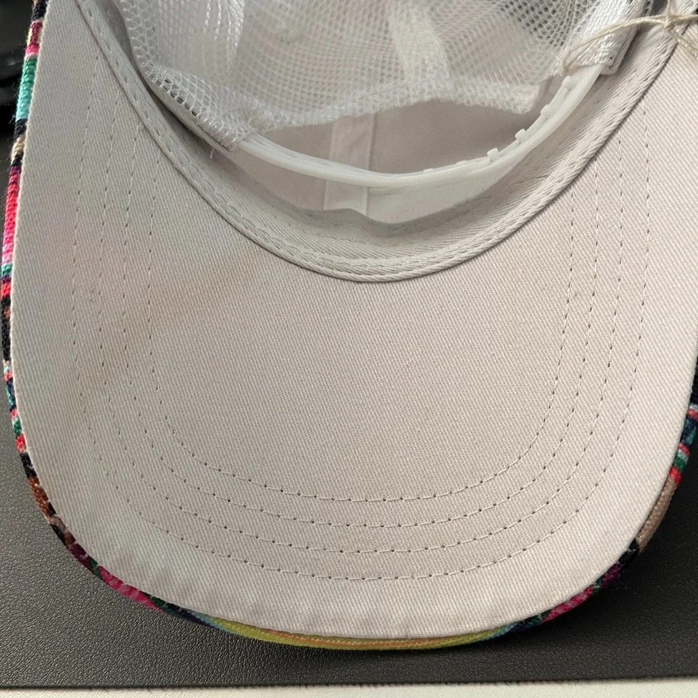 This is a serape and leopard print mesh baseball cap with a Velcro back